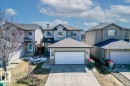 Two-story property with attached garage, light gray siding, and dark gray shingle roof - 1130 Westerra Way, Stony Plain, AB  - Outdoor With Facade 