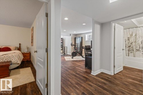 Wood-finish flooring throughout, with white trim and solid core doors - 1130 Westerra Way, Stony Plain, AB - Indoor
