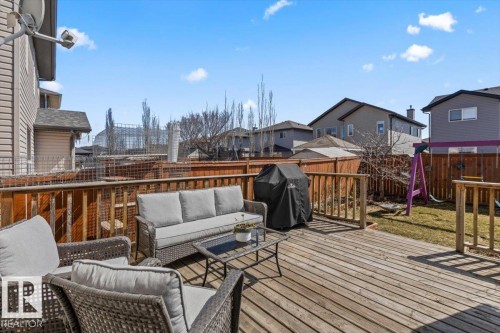 Expansive wooden deck with railing, offering a generous outdoor living area - 1130 Westerra Way, Stony Plain, AB - Outdoor With Deck Patio Veranda With Exterior