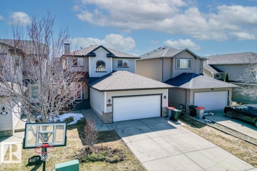 Two-story residence featuring light-toned siding and dark trim accents - 1130 Westerra Way, Stony Plain, AB - Outdoor