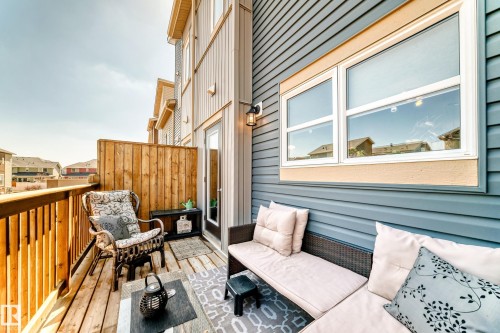 Exterior balcony featuring wood decking and privacy fencing - 115 401 Southfork Drive, Leduc, AB - Outdoor With Balcony With Exterior