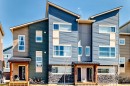 Modern multi-unit dwelling with a tiered roofline - 115 401 Southfork Drive, Leduc, AB  - Outdoor With Facade 