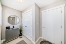 Foyer with light neutral wall paint, white trim, and light flooring - 115 401 Southfork Drive, Leduc, AB  - Indoor Photo Showing Other Room 