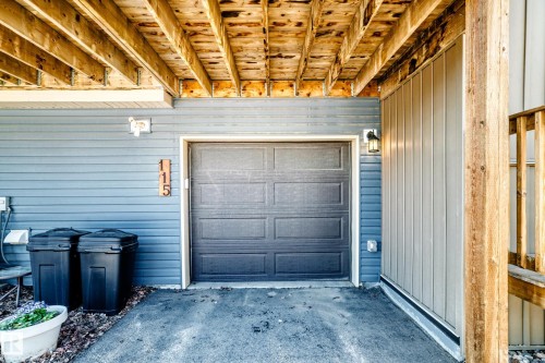 Single garage door entry with asphalt driveway - 115 401 Southfork Drive, Leduc, AB - Indoor