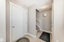 Entryway featuring tiled flooring, a flush-mount ceiling light, white trim, and neutral wall paint - 115 401 Southfork Drive, Leduc, AB  - Indoor Photo Showing Other Room 