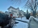Multi-unit residential property featuring light-colored siding and dark shingle roofing - 10905 74 Avenue, Edmonton, AB  - Outdoor 