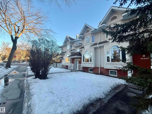 Multi-level facade featuring varied window styles, including arched and bay windows - 10905 74 Avenue, Edmonton, AB - Outdoor