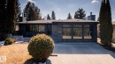 Contemporary residence featuring a dark-toned exterior facade with large, reflective windows - 4204 Aspen Drive E, Edmonton, AB  - Outdoor 