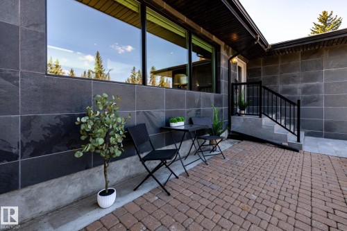 Exterior wall clad in large format dark gray tiles - 4204 Aspen Drive E, Edmonton, AB - Outdoor With Exterior