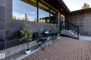 Exterior wall clad in large format dark gray tiles - 4204 Aspen Drive E, Edmonton, AB  - Outdoor With Exterior 