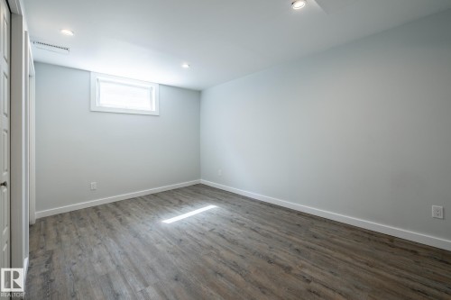 Room featuring wood-finish flooring and light-toned walls - 4204 Aspen Drive E, Edmonton, AB - Indoor Photo Showing Other Room