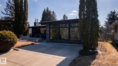 Contemporary facade featuring extensive window panels and a dark-toned exterior - 4204 Aspen Drive E, Edmonton, AB - Outdoor