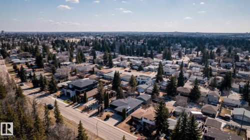 Expansive residential area featuring numerous individual properties, mature evergreen trees, and paved roadways - 4204 Aspen Drive E, Edmonton, AB - Outdoor With View