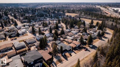 Aerial perspective showcasing a residential area with a mix of single-family homes and mature trees - 4204 Aspen Drive E, Edmonton, AB - Outdoor With View
