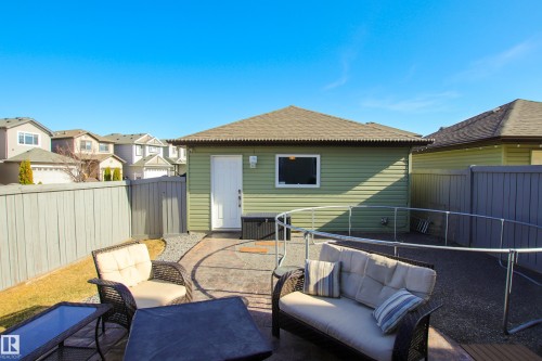 Detached rear structure with horizontal siding and shingle roofing - 3805 170A Avenue, Edmonton, AB - Outdoor With Deck Patio Veranda With Exterior