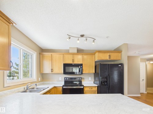 208 4403 23 Street, Edmonton, AB - Indoor Photo Showing Kitchen With Double Sink