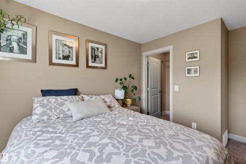 Bedroom featuring neutral wall paint, white trim, and carpet flooring - 2313 Sparrow Crescent, Edmonton, AB - Indoor Photo Showing Bedroom