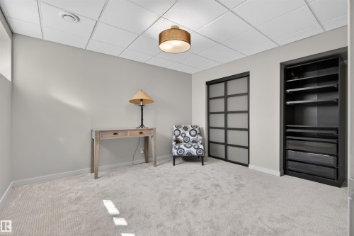 Light gray wall tones with complementing carpeting - 2313 Sparrow Crescent, Edmonton, AB - Indoor Photo Showing Other Room