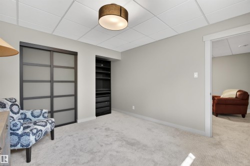 Recessed ceiling with acoustic tiles - 2313 Sparrow Crescent, Edmonton, AB - Indoor Photo Showing Other Room