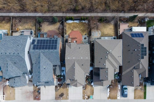 Aerial perspective of multiple homes featuring distinct rooflines and some properties with solar panel installations - 2313 Sparrow Crescent, Edmonton, AB - Outdoor