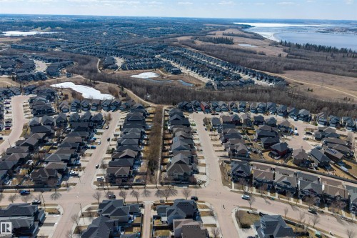 Aerial perspective showcasing a residential community with numerous detached homes - 2313 Sparrow Crescent, Edmonton, AB - Outdoor With View