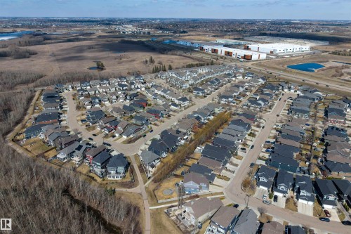 Aerial overview of a residential development featuring diverse architectural styles and dark-toned roofing - 2313 Sparrow Crescent, Edmonton, AB - Outdoor With View