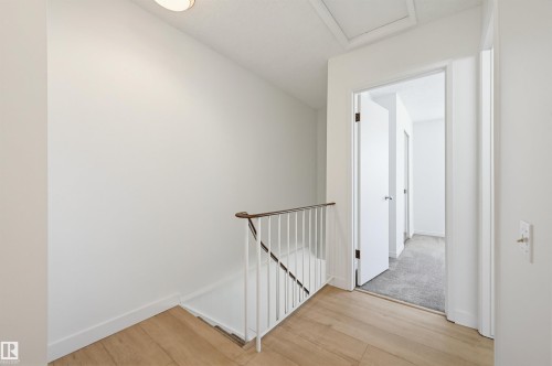 Upper landing featuring wood-finish flooring, white walls, and a recessed ceiling light - 8043 178 Street, Edmonton, AB - Indoor Photo Showing Other Room
