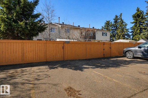 Expansive parking area featuring asphalt paving with painted lines - 8043 178 Street, Edmonton, AB - Outdoor