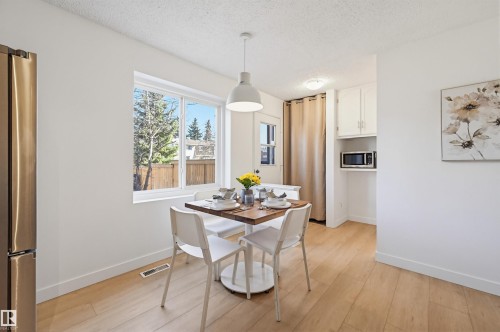 Bright dining area with wood-finish flooring - 8043 178 Street, Edmonton, AB - Indoor