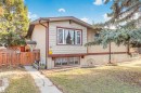 Split-level residence featuring a neutral stucco and horizontal siding facade with contrasting trim - 1619 Knottwood Road N, Edmonton, AB  - Outdoor 
