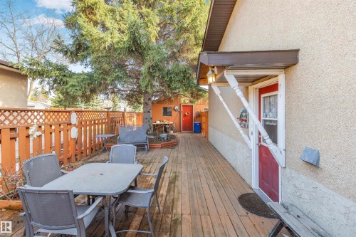 Expansive wood-finish deck with privacy fencing - 1619 Knottwood Road N, Edmonton, AB - Outdoor With Deck Patio Veranda With Exterior