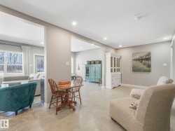 Spacious interior with neutral wall tones and recessed lighting - 