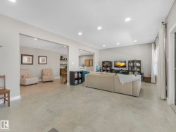 Spacious interior featuring light gray walls and polished concrete flooring - 