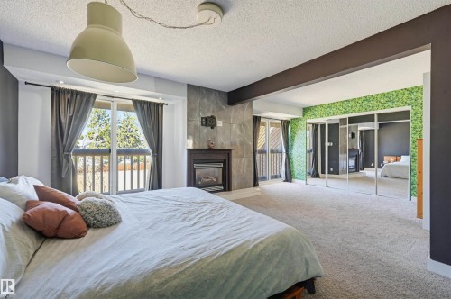 139 Wolf Willow Crescent, Edmonton, AB - Indoor Photo Showing Bedroom With Fireplace