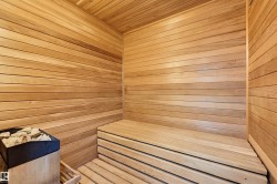 Interior sauna with horizontal wood plank walls and ceiling - 