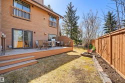 Spacious wooden deck with multiple steps and sliding glass door access - 