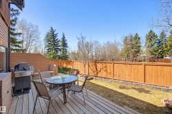 Exterior wood-finish siding with a private wood deck - 