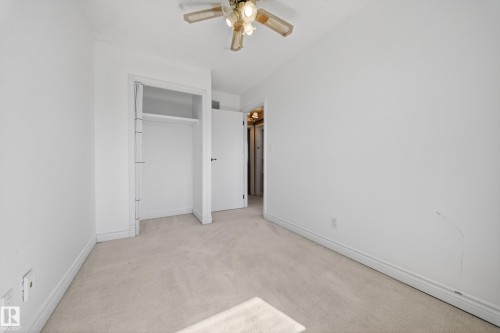 Neutral tone carpeting extending throughout the room - 1767 61 Street, Edmonton, AB - Indoor Photo Showing Other Room