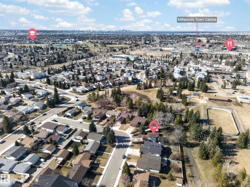 Aerial perspective showcasing the residential neighborhood with a variety of single-family homes and mature trees - 1767 61 Street, Edmonton, AB - Outdoor With View