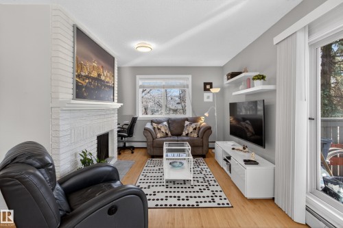 211 10838 108 Street, Edmonton, AB - Indoor Photo Showing Living Room With Fireplace