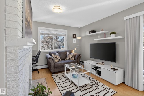 211 10838 108 Street, Edmonton, AB - Indoor Photo Showing Living Room