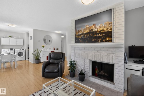 211 10838 108 Street, Edmonton, AB - Indoor Photo Showing Living Room With Fireplace