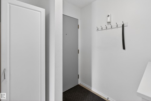 Entrance Door - 211 10838 108 Street, Edmonton, AB - Indoor Photo Showing Other Room