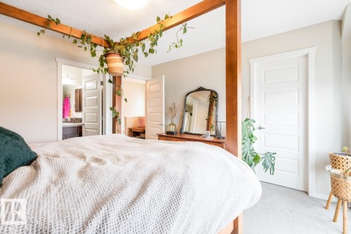 Bedroom featuring light-colored walls and soft carpet flooring - 5127 1A Avenue, Edmonton, AB - Indoor Photo Showing Bedroom