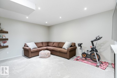Neutral-toned room featuring light gray walls, recessed lighting, and plush carpet flooring - 5127 1A Avenue, Edmonton, AB - Indoor