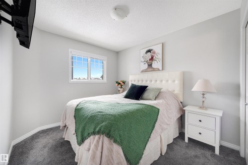 Bedroom featuring grey wall-to-wall carpeting and a ceiling-mounted light fixture - 2504 Coughlan Road, Edmonton, AB - Indoor Photo Showing Bedroom