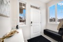 Bright entryway featuring a paneled door with transom window, tile flooring, and multiple large windows - 2504 Coughlan Road, Edmonton, AB  - Indoor Photo Showing Other Room 