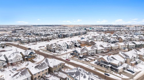Aerial perspective showcasing a residential development with varied architectural styles - 2504 Coughlan Road, Edmonton, AB - Outdoor With View