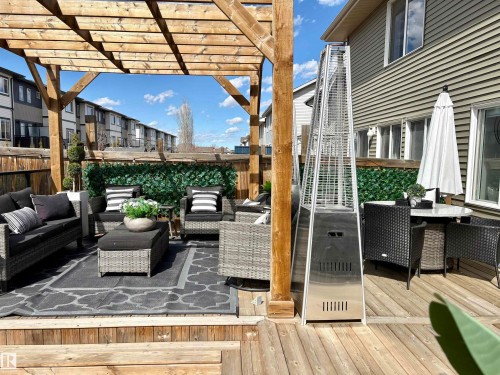 Expansive wooden deck featuring a slatted pergola structure - 2504 Coughlan Road, Edmonton, AB - Outdoor With Exterior