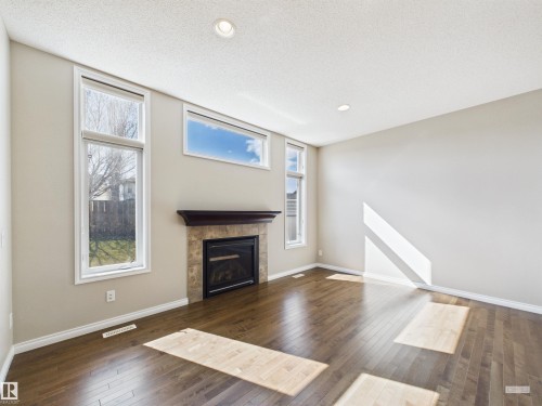91 Copperhead Place, Stony Plain, AB - Indoor Photo Showing Living Room With Fireplace